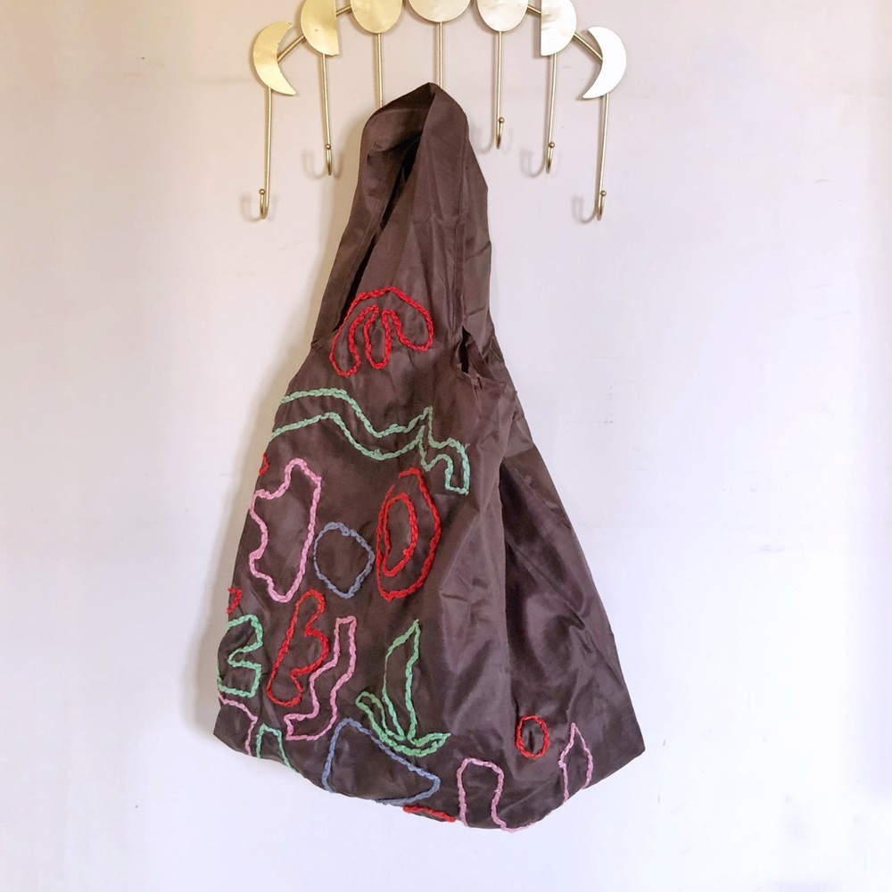 Hand embroidered nylon baggu